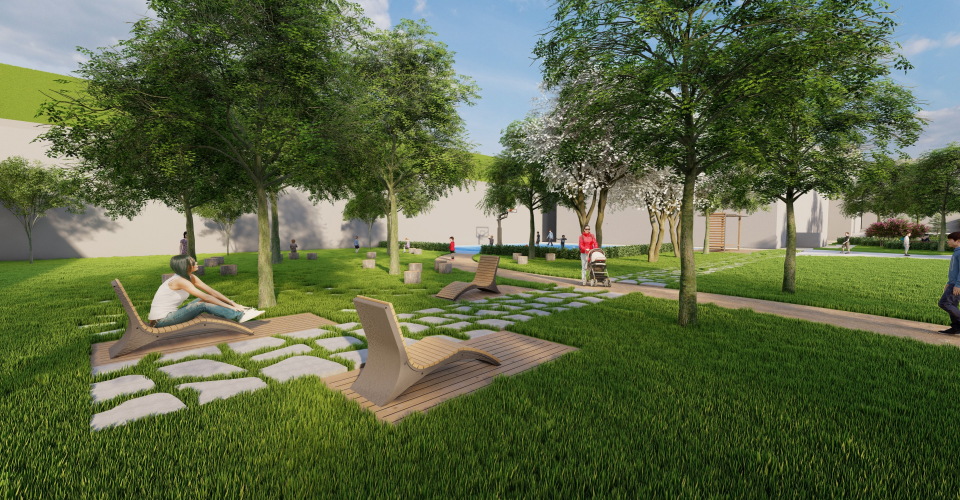 잔디 곳곳에 사람이 앉을 수 있는 의자들이 각각 배치되어있고 공원을 돌아다니는 사람들이 있다.