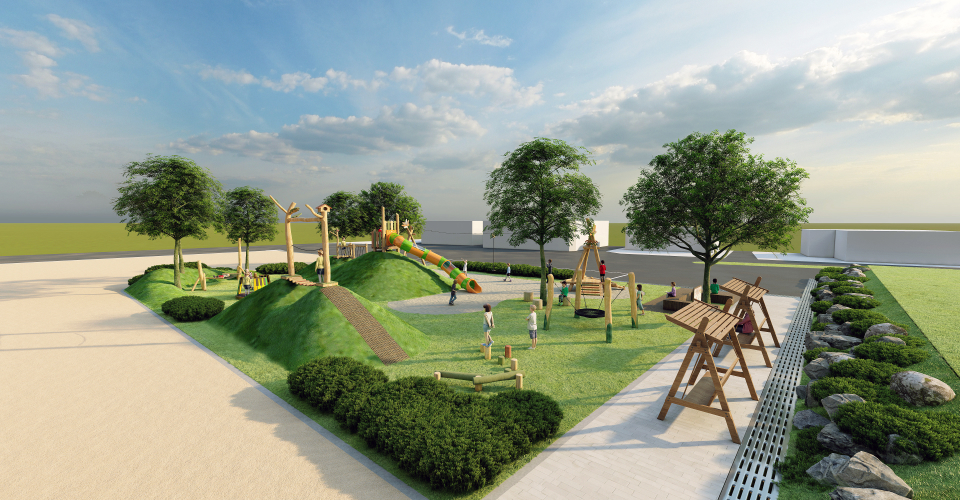 친환경 상상놀이터 조경, 잔디가 깔려있으며 친환경으로 제작된 놀이기구들이 배치되어있는 모습을 측면에서 바라본 모습